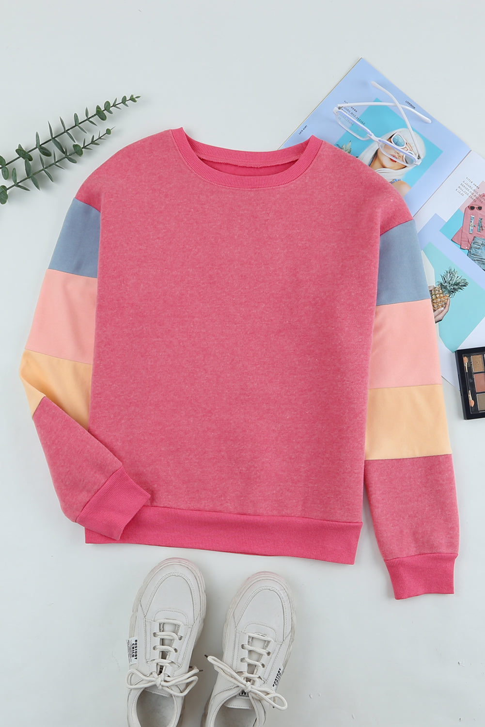 Pink color block sweatshirt with crewneck and long sleeves.