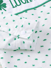 White cotton baby set with green embroidered shamrocks and text, featuring a buttoned cuff.