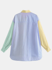 Colorblock striped oversized button-down shirt with light green and yellow sleeves.