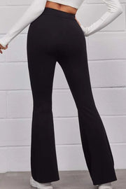 Black flare freestyle trousers with a high waist, showing the back view.