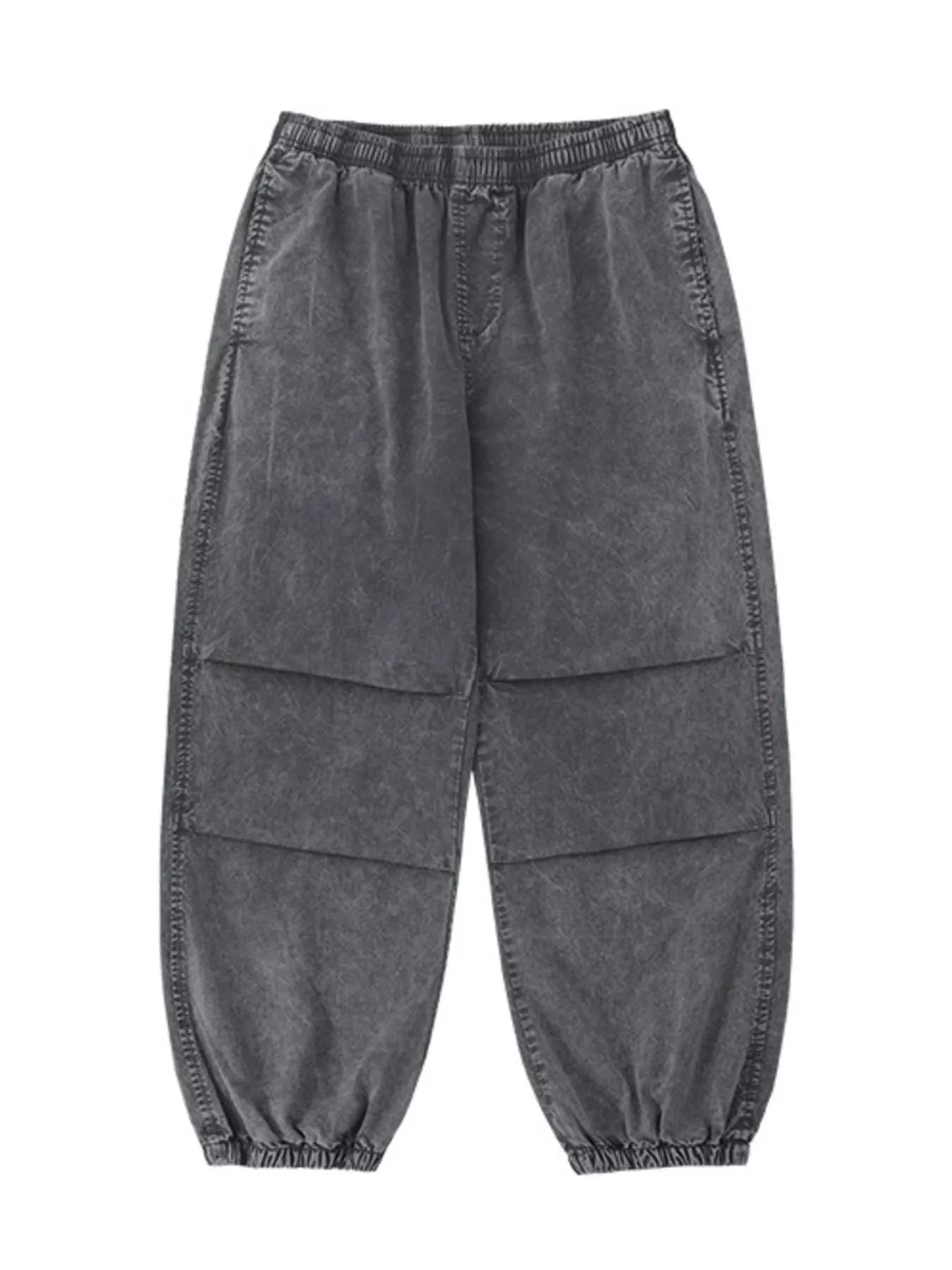 Grey relaxed fit cargo pants with elastic waistband and cuffs, and paneled legs.