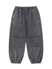 Grey relaxed fit cargo pants with elastic waistband and cuffs, and paneled legs.