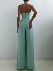 Mint green ruched spaghetti strap wide-leg jumpsuit with a high waist.