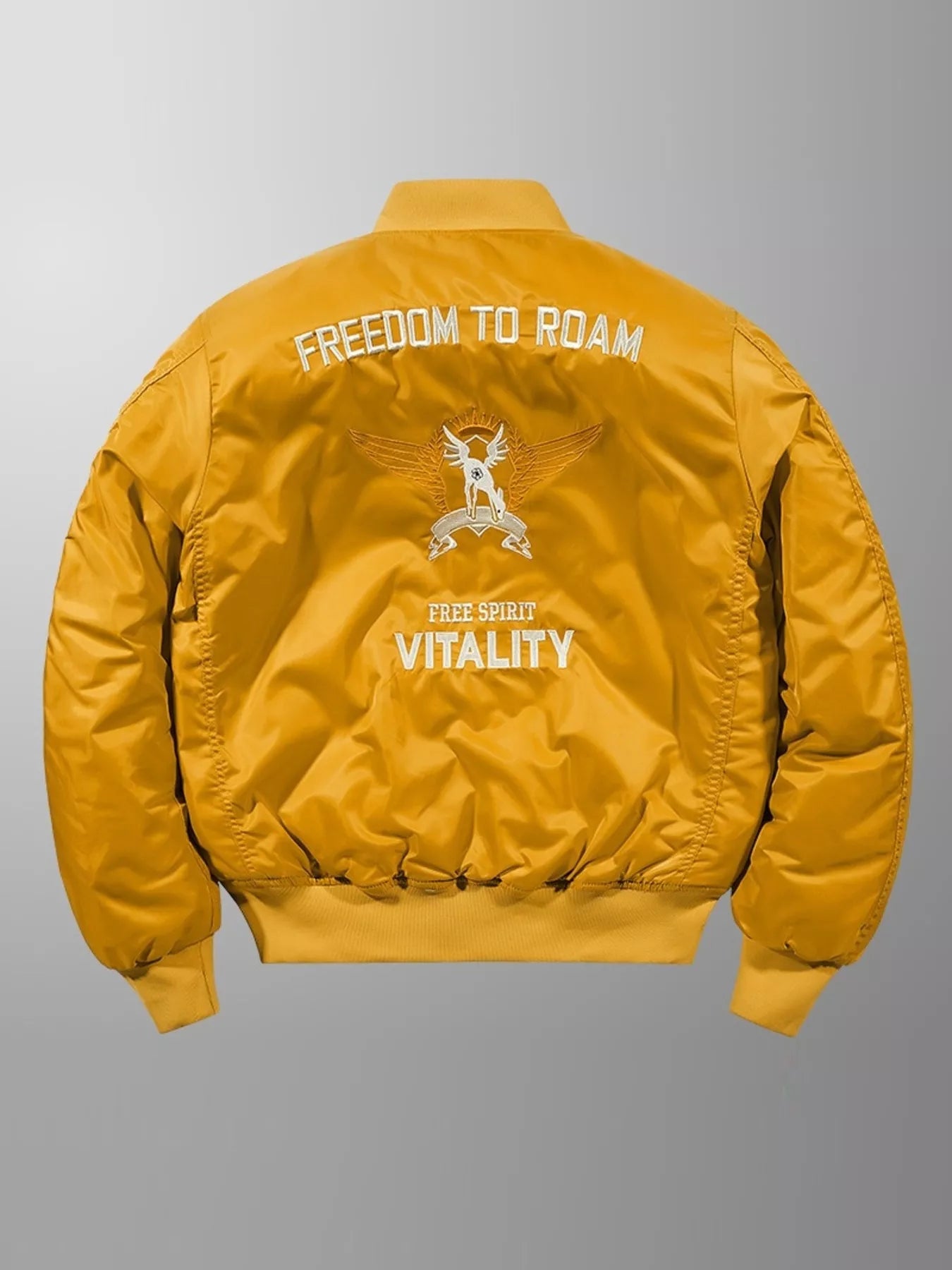 Men's yellow bomber jacket with embroidered "FREEDOM TO ROAM" and "VITALITY" graphics on back.