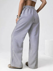 Navy striped high-waisted wide-leg pants with drawstring detail.