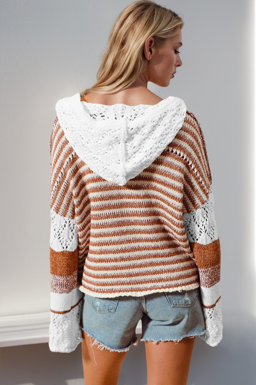 Striped crochet hooded pullover sweater in camel with white crochet details and a relaxed fit.