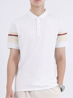 White combed cotton polo with striped sleeve accents and a classic collar.