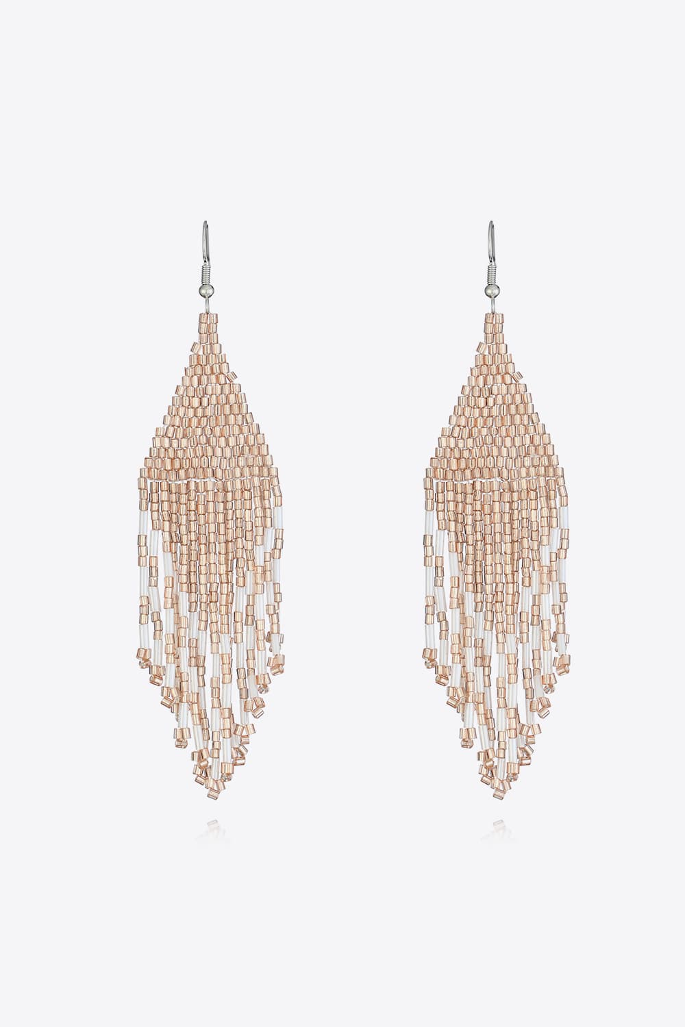 Prismatic beaded fringe earrings in apricot and clear beads with a cascading design.