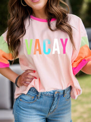 Colorblock vacay graphic tee in watermelon pink with neon trim and colorful sleeves.