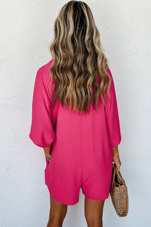 Oversized hot pink romper with pockets and 3/4 sleeves.