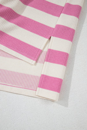 Colorblock stripe waffle knit top in pink and cream cotton, featuring a textured weave.