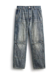 Men's blue straight leg jeans with patchwork and textured pockets.