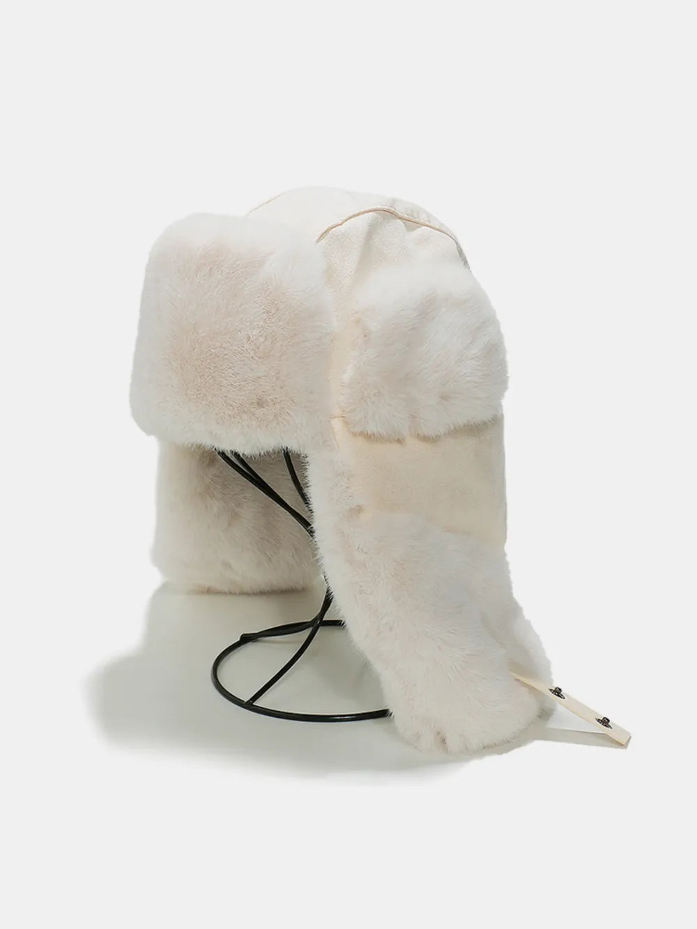 Ivory shearling aviator trapper hat with faux fur trim and ear flaps.