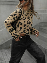 Cropped fuzzy knit sweater with playful leopard print and long sleeves.