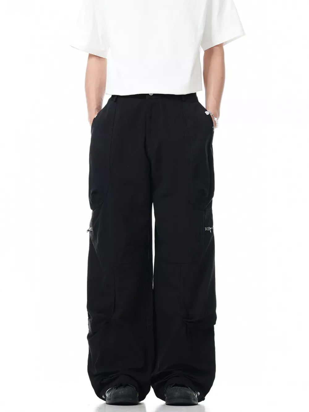 Black men's cargo pants with multiple zippered pockets and a relaxed fit.