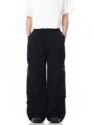 Black men's cargo pants with multiple zippered pockets and a relaxed fit.