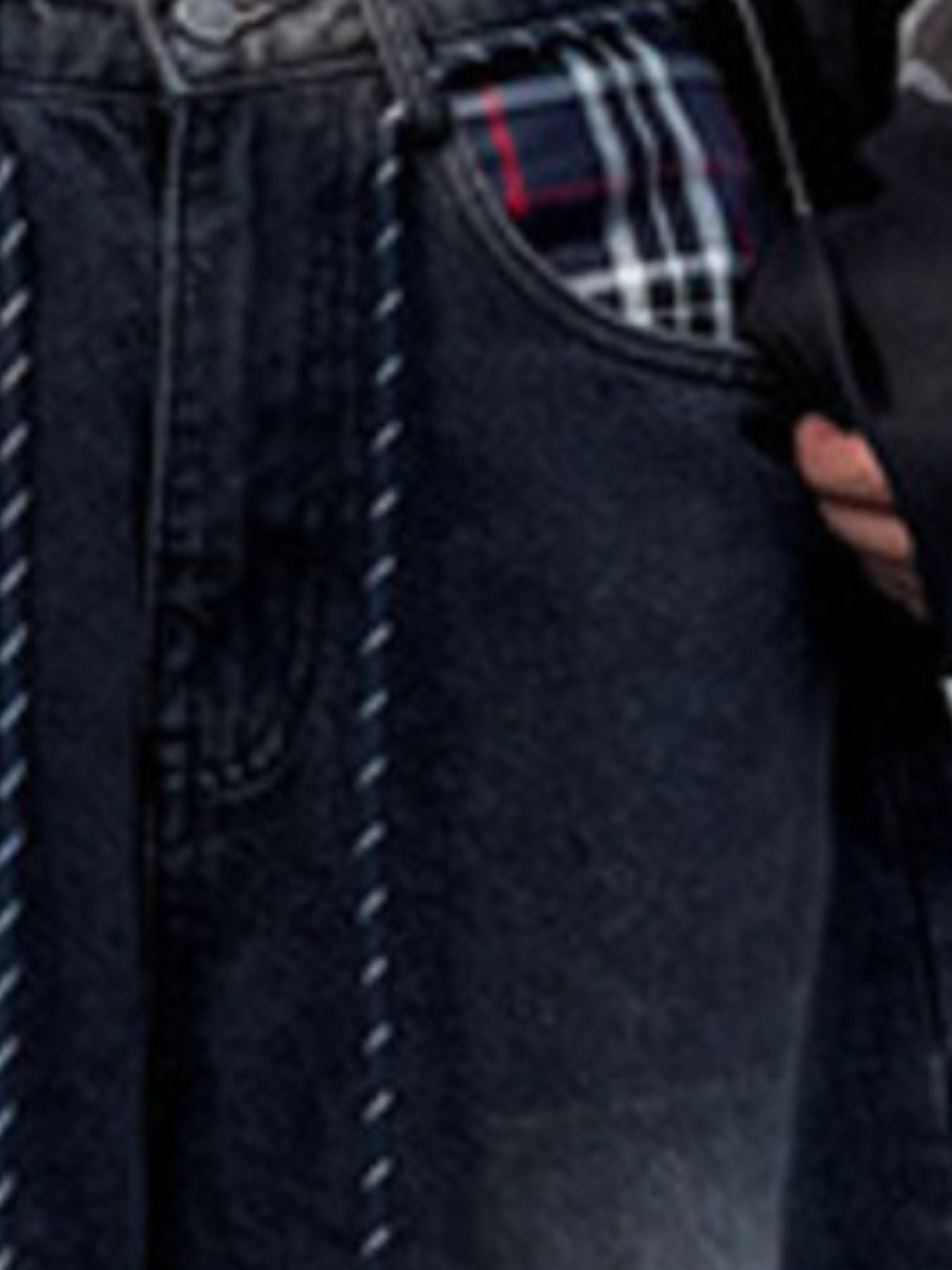 Men's dark grey vintage wash drawstring jeans with plaid pocket lining.