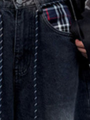 Men's dark grey vintage wash drawstring jeans with plaid pocket lining.