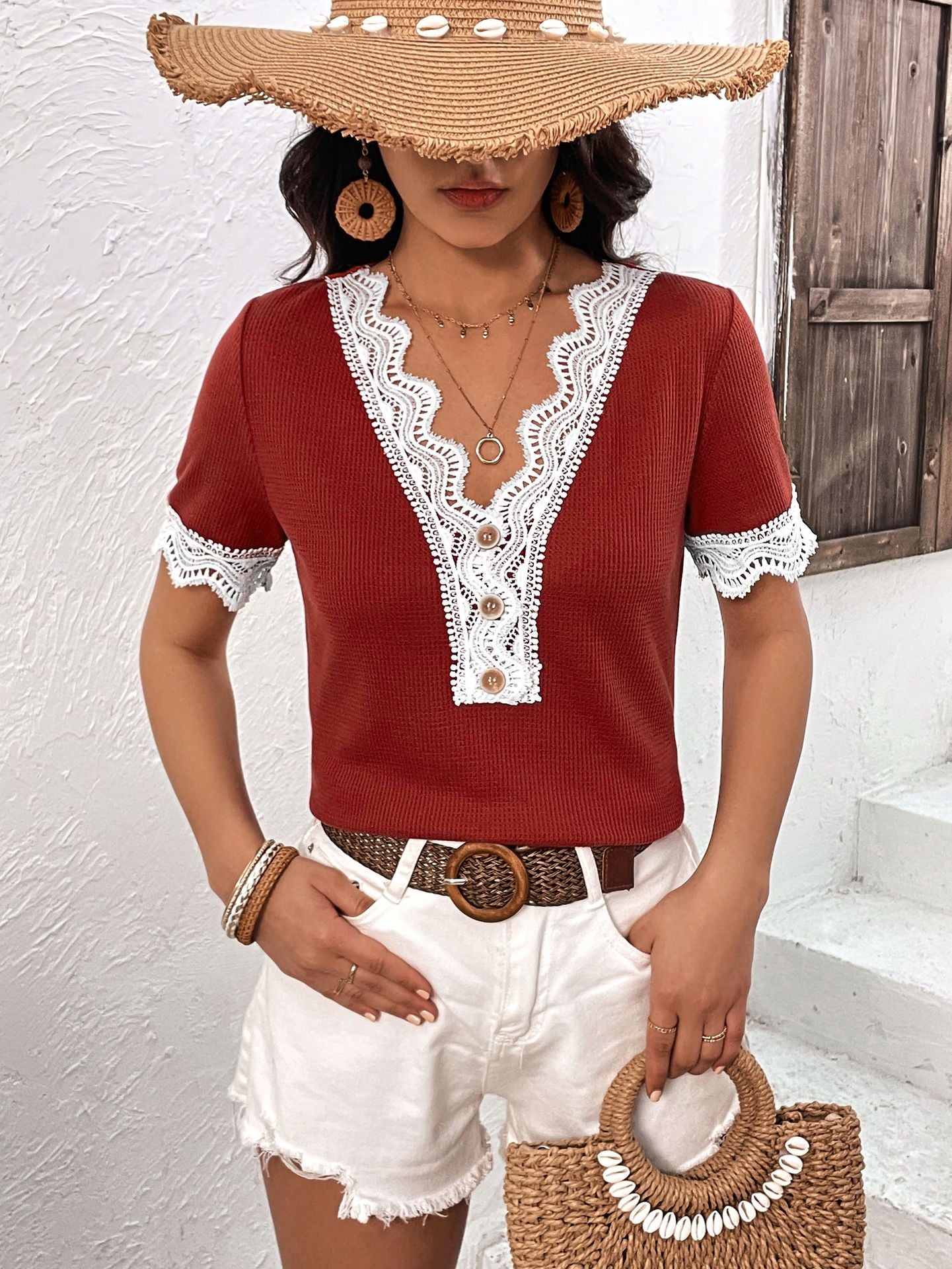 Burgundy waffle knit henley with white lace trim and button detail.