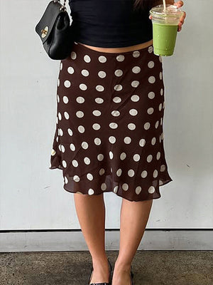 A-line mesh polka dot skirt in brown with white dots, featuring a ruffled hem.