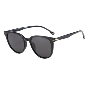 Black cat-eye sunglasses with polycarbonate frame and gold accents