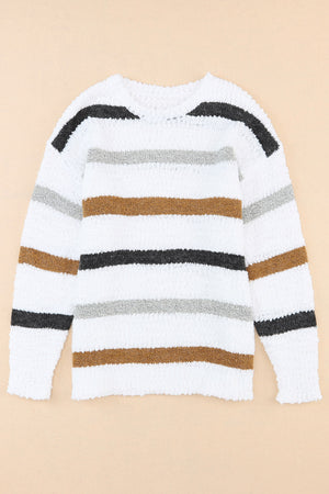 Textured stripe slouchy knit sweater in white with brown, grey, and black stripes.