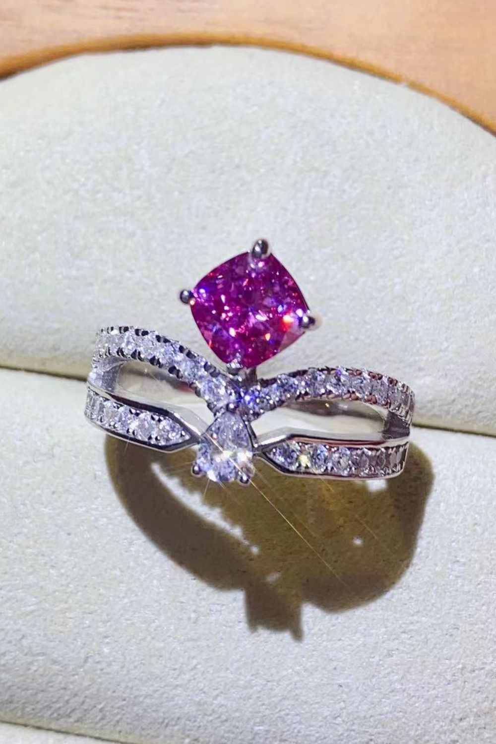 Pink moissanite bow ring with pavé detail in sterling silver