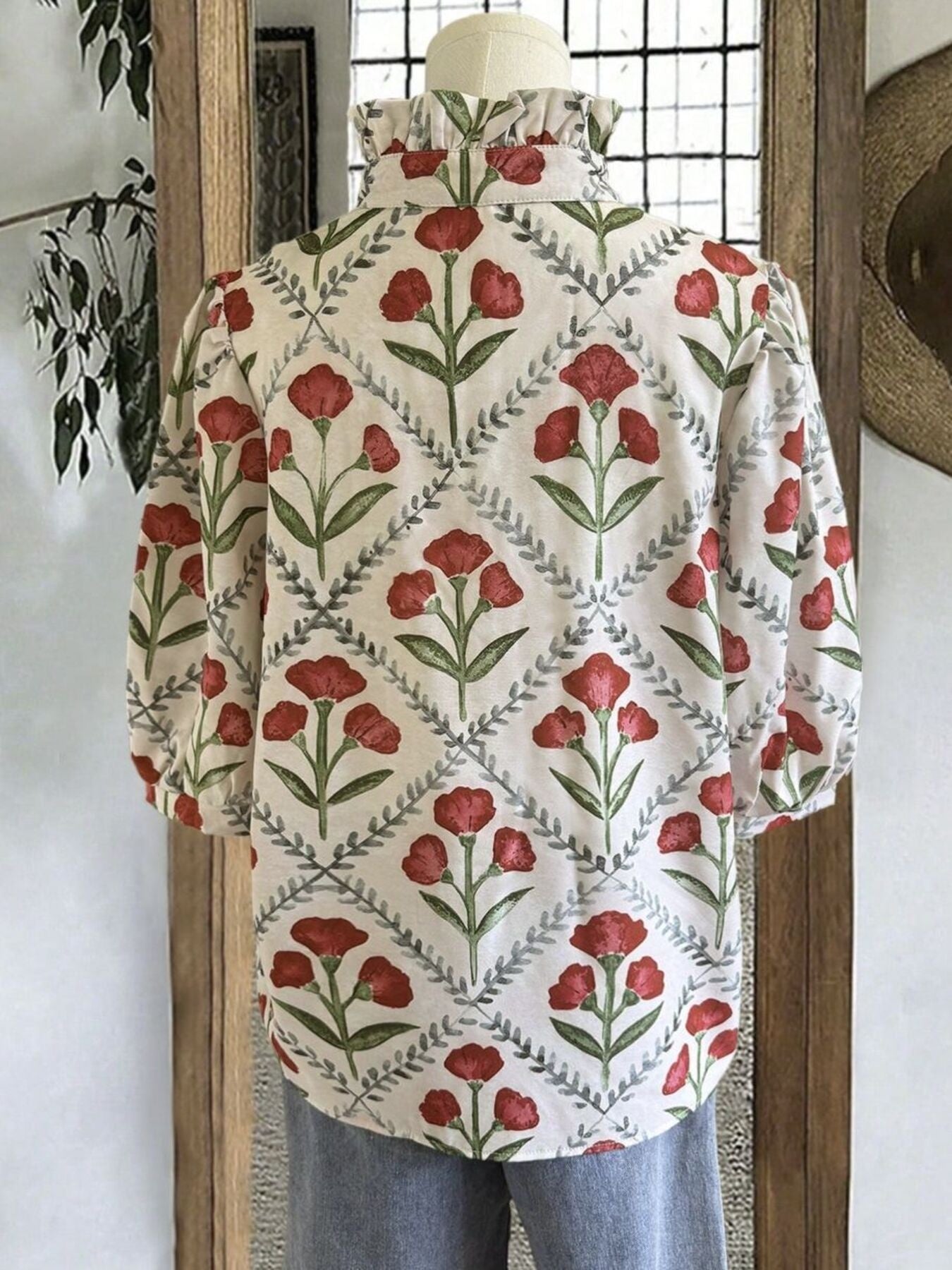 Ruffle collar blouse with red floral print and puff sleeves.