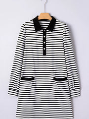 Black and white striped collared long sleeve dress with button front and two front pockets.