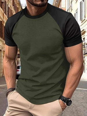 Colorblock raglan tee in olive green with black sleeves and crew neck.