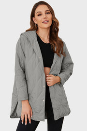 Light gray quilted hooded parka with snap front and diamond stitching.