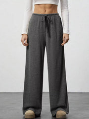 Dark gray ribbed wide-leg pants with drawstring waist and relaxed fit.