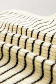Ivory knit polo vest with black stripes, textured ribbed fabric detail