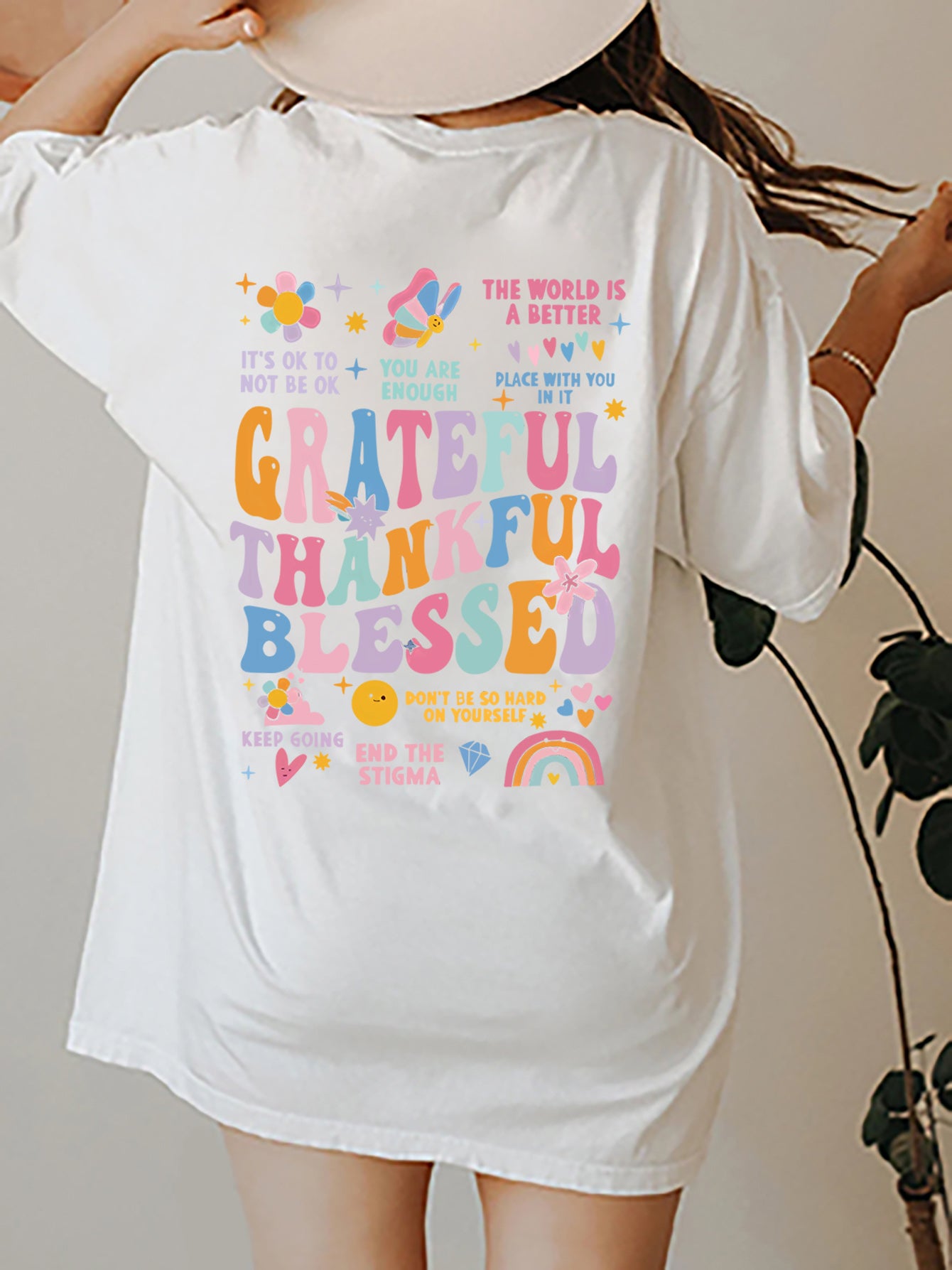 White graphic tee with colorful "Grateful Thankful Blessed" text and affirmations.