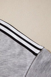 Grey relaxed t-shirt with black and white shoulder stripes