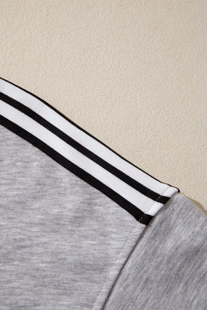 Grey relaxed t-shirt with black and white shoulder stripes