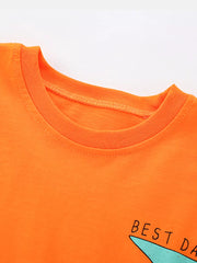 Orange cotton toddler t-shirt with a graphic and text detail.