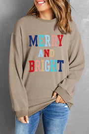 Camel ribbed sweatshirt with "Merry and Bright" text in colorful letters