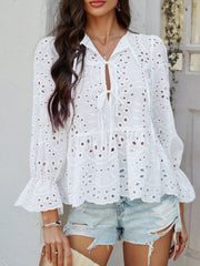 White eyelet embroidered peplum blouse with tie neck and ruffled bell sleeves