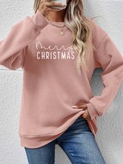 Blush pink crewneck sweatshirt with white Merry Christmas graphic, ribbed cuffs and hem.