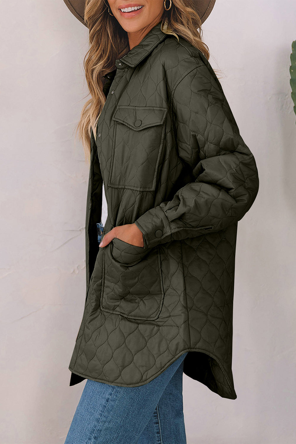 Army green quilted utility jacket with diamond pattern, chest pockets and button cuffs.