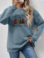 Misty Blue crewneck sweatshirt with a graphic Christmas tree print and text that reads Rocking Around the Christmas Tree.