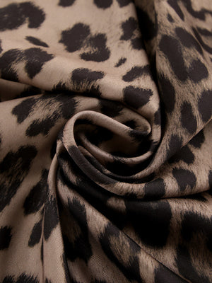 Flowy leopard print maxi skirt in brown and black animal print fabric.