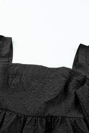 Black textured peplum blouse with square neckline and petal sleeves