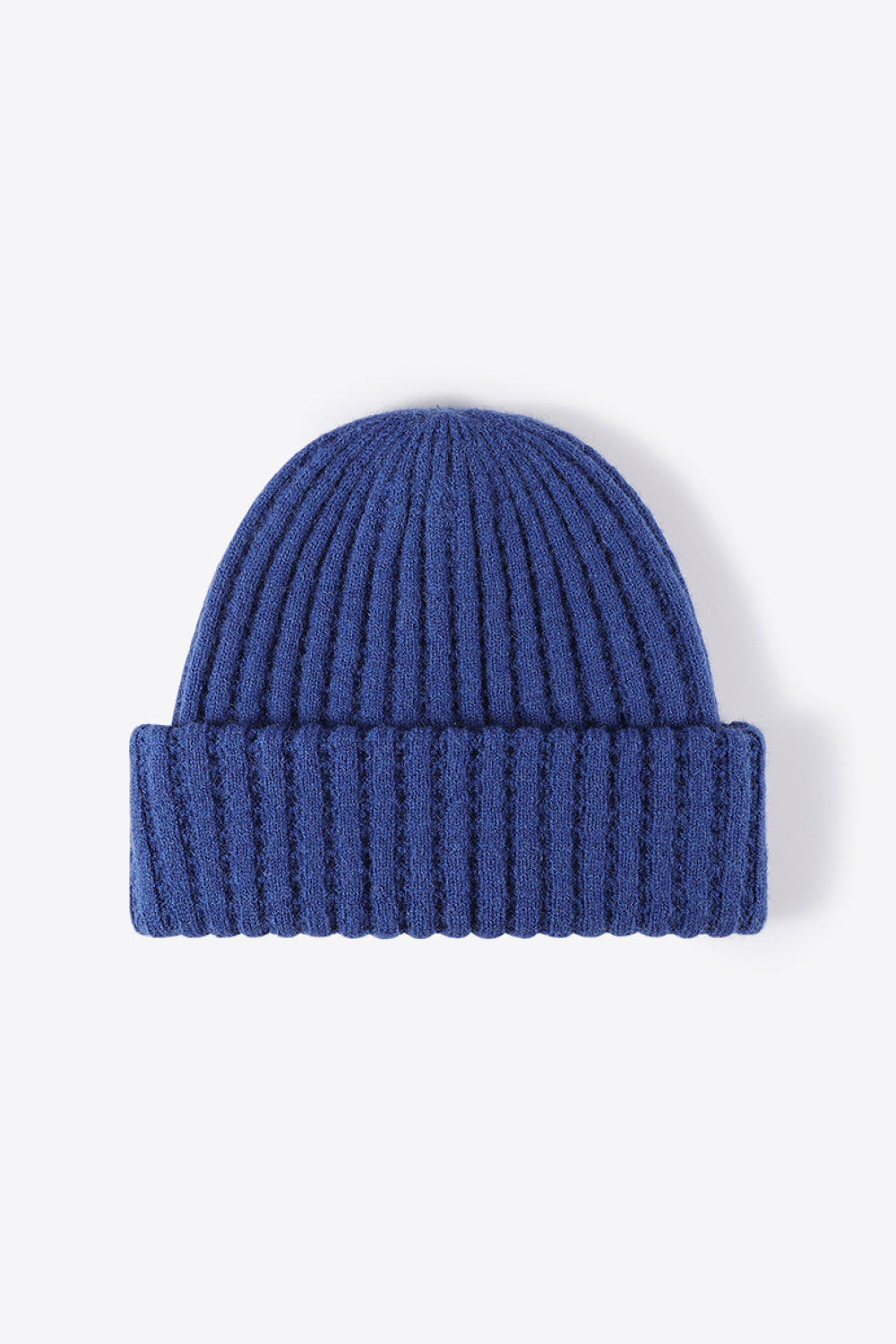 Textured ribbed knit beanie in Indigo acrylic with a cuffed hem.