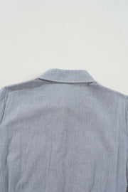 Pinstripe shirred waist romper with tie, close-up of collar and upper back.