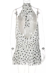 White polka dot halter neck mini dress with ruched waist and tiered hem