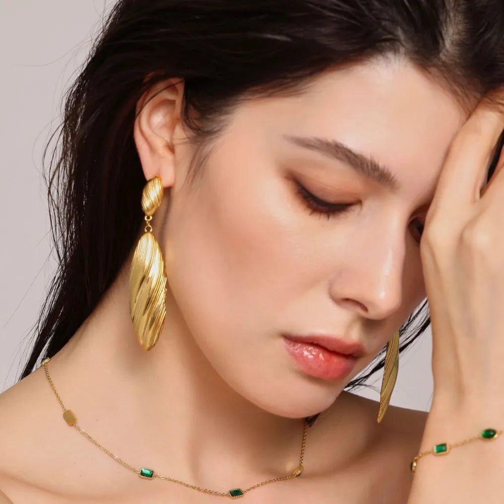 Textured gold leaf drop earrings with ribbed detail