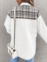 White denim jacket with brown plaid paneling on the upper back and sleeves.