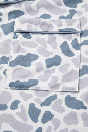 Blue camouflage print pajama set with button-down top and chest pocket detail.
